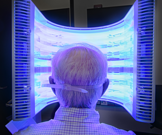 Photo of patient getting Blue Light treatment